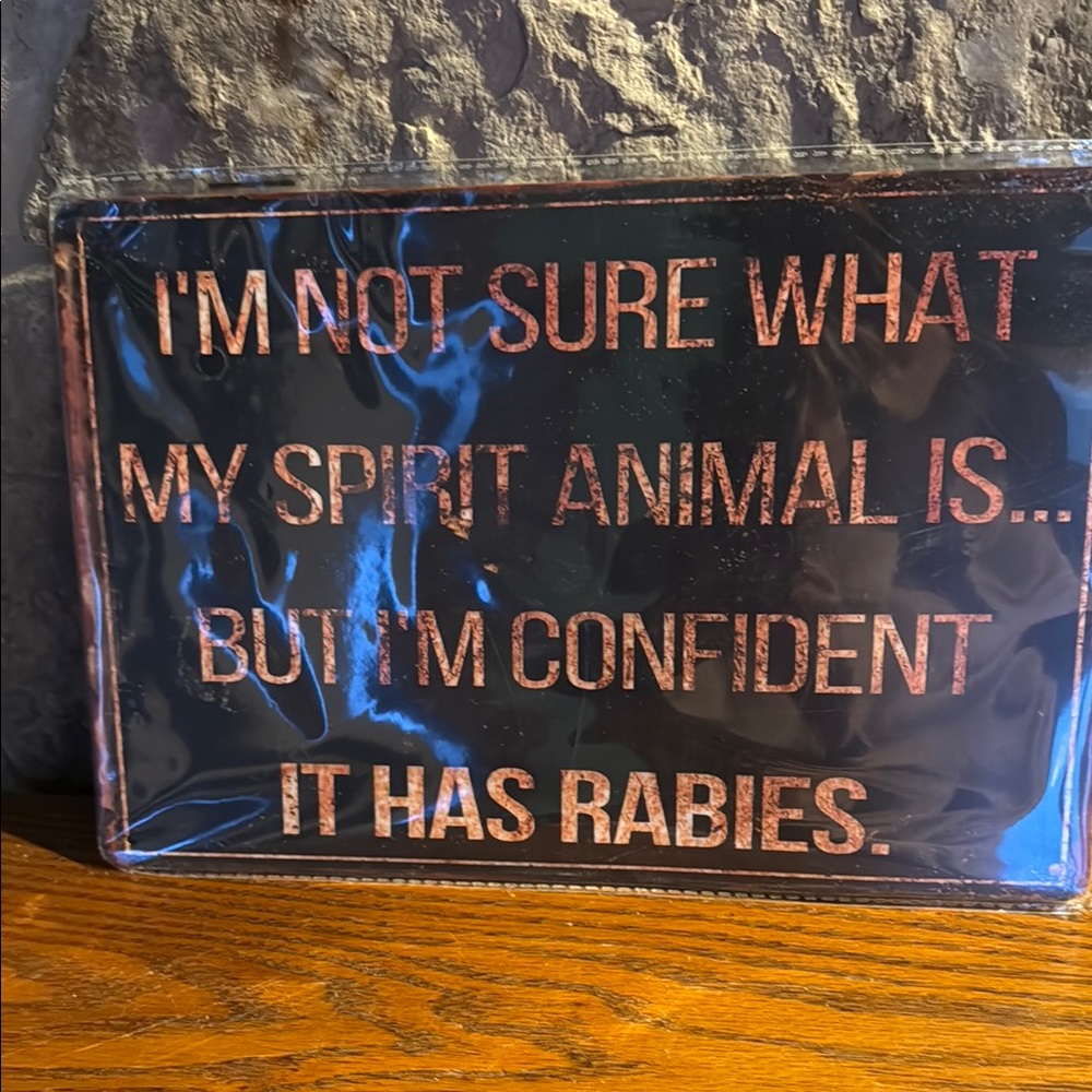 Sign - “ I’m not sure what my spirit animal is but I’m confident it has rabies”